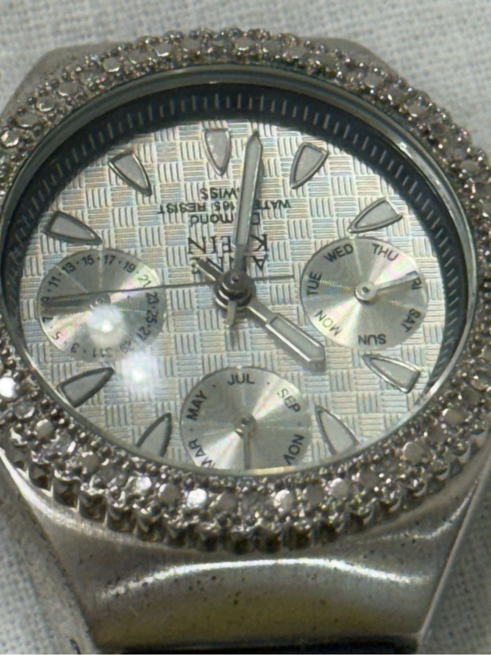 Anne Klein Women’s Crystal Bezel Multifunction Watch Black Leather Strap